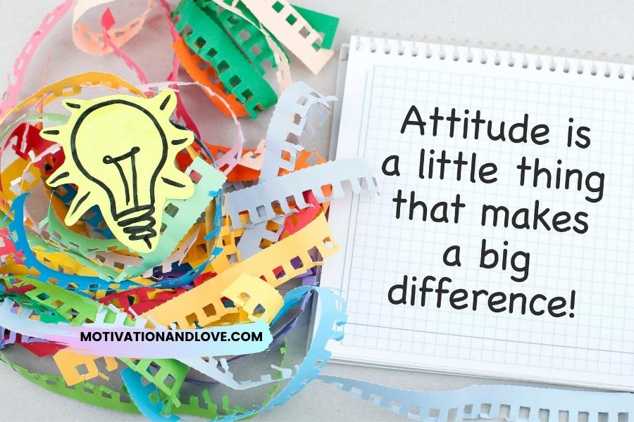A light bulb drawing on yellow paper sits on a pile of colorful paper chain strips; a notebook with the phrase, "Attitude is a little thing that makes a big difference!", is to the right.